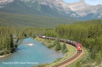 CP AC4400 locomotive 9736 pulls a train of tank cars through Morant's Curve on a sunny July day in 2005.